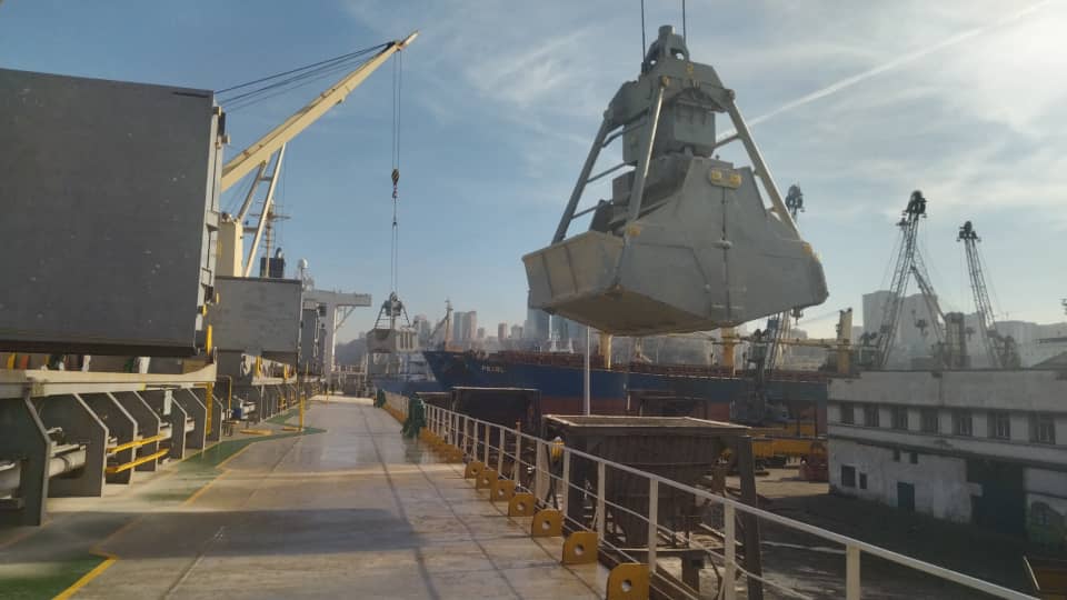 Cargo discharge with grab crane at Algerian port